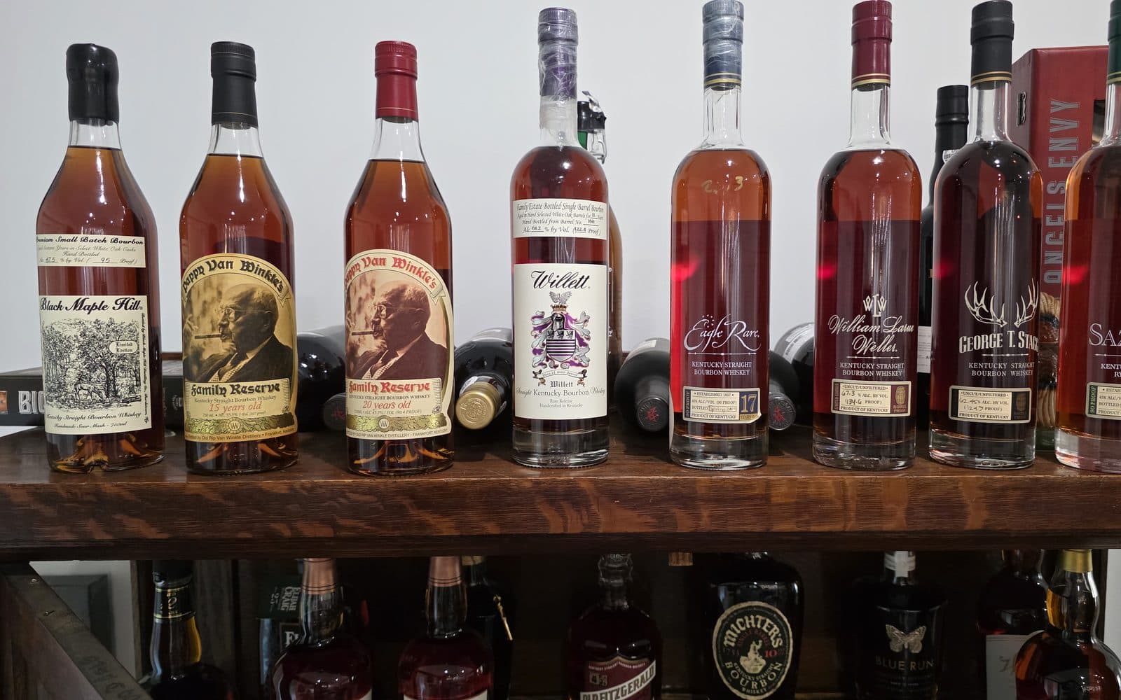 A shelf of acquired bottles, Black Maple Hill, Pappy Van Winkle 15 and 20 Year, Willett Family Estate and George T. Stagg among them
