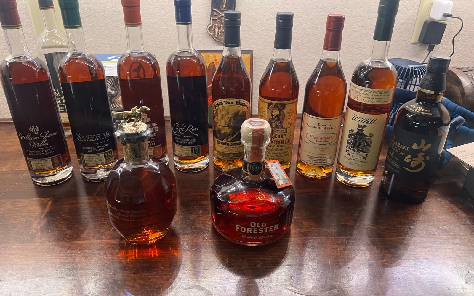 Thirteen-bottle lot spanning the Van Winkle line, the Buffalo Trace Antique Collection, Old Forester Birthday Bourbon and Yamazaki 18