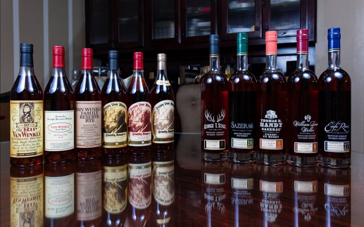 Eleven-bottle lot: the Van Winkle line beside the Buffalo Trace Antique Collection